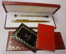 A late 20th Century Must de Cartier Gold Plated Ballpoint Pen, in original fitted case with