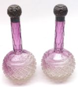 A pair of Purple and Clear Glass Dressing Table Bottles, with hobnail cut design, fitted with floral