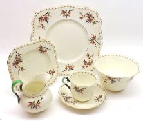 A Tuscan Tea Set, patterned with coloured floral sprays, comprising nine Trios, further Plates and