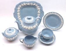A Wedgwood Tea Service, decorated with white vine leaf design on a blue background, comprising