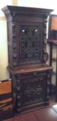 A large late Victorian Gothic Carved Oak Side Cabinet, the top with extensive carved detail and