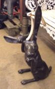 A 20th Century Patinated Bronze Model of a sitting hare, 24” high