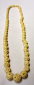 An early 20th Century Carved and Pierced Bone Bead Necklace