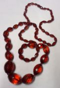 An Edwardian facetted Cherry Red Amber Bead Necklace, total weight approximately 56 gm, 88cm long
