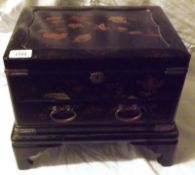 An early 20th Century Oriental Lacquered Table Casket of rectangular form, the lifting lid enclosing