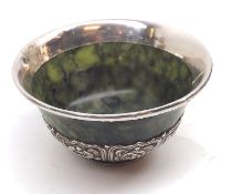 A Chinese Spinach Jade and white metal mounted Bowl with slightly everted rim, the foot embossed