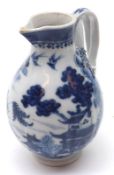 A Chinese Export Sparrow Beak Jug of ribbed baluster form, typically painted in underglaze blue with