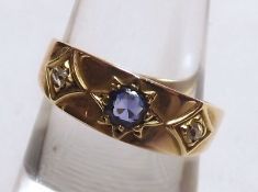 An early 20th Century high grade precious metal Ring, set with two small Rose Cut Diamonds and a