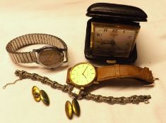 A Mixed Lot comprising:  A folding Travel Clock, two various base metal cased Wrist Watches, a