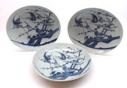 A set of three Oriental Circular Plates, each decorated in underglaze blue with panels of exotic