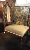 A Victorian Nursing Chair with elegant back barley twists supports, upholstered central back panel