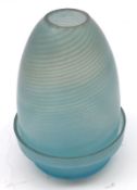 An unusual two-piece Night Light Holder of round coned form, decorated in a swirled blue design,
