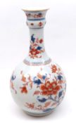 An Arita or Imari Baluster Vase, decorated in iron red, underglaze blue and with gilded detail