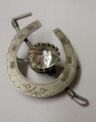 A late 19th Century/early 20th Century hallmarked Silver horseshoe and riding crop Brooch with white