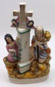 A 19th Century Staffordshire Figure Group, Pilgrims Progress, modelled as figures around a cross,