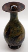 A Doulton Lambeth flared lip Baluster Vase, decorated with fern leaves on a grey/brown background,