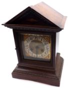 An early 20th Century Oak cased Mantel Clock, Junghans, the case with architectural pediment, over a