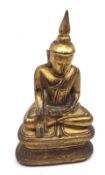 A Carved Giltwood Seated Sakyamuni on a double lotus throne, 10 ½” high