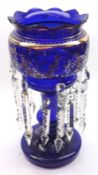 A large Victorian Blue Glass Lustre Vase, with frilled rim decorated with gilt and coloured floral