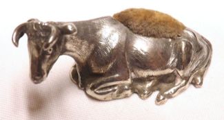 A Victorian Novelty Pin Cushion, modelled as a recumbent cow, Sheffield 1871, 1 ¾” long