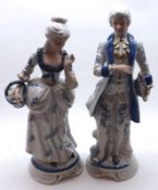 A pair of modern Figures of lady and gent wearing 18th Century costume, 13 ½” high