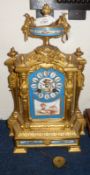 A late 19th Century French Porcelain Mounted and Gilt Spelter Mantel Clock, the shaped case