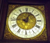 An Oak Longcase Clock, later carved throughout, the square brass dial with silvered circular black