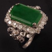 A Platinum Rectangular Emerald Jade Panelled Ring with eighteen Brilliant Cut Diamonds in