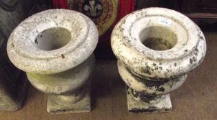 A pair of small Marble Urns of typical form, on square plinth bases, 9 ½” wide