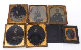 A collection of five various Daguerreotype Portraits, one depicting an old man in a bowler hat