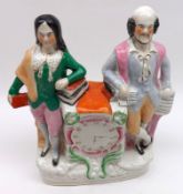 A 19th Century Staffordshire Clock Figure Group, modelled as a couple leaning on a central clock,