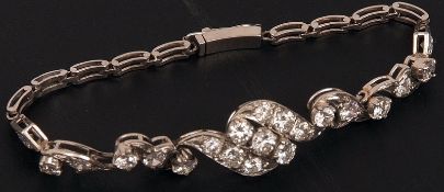 An unmarked precious metal Bracelet set with twenty-one graduated Diamonds, approximately 3 ct total