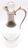 A 20th Century Clear Glass Claret Jug of typical bulbous form, fitted with a silver collar and