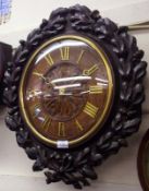A late 19th Century mid European dial Clock, the carved surround formed as an Oak Leaf and Acorn