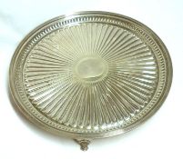 A Victorian Round Salver, decorated with continuous raised design to a vacant central cartouche,