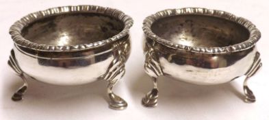 A pair of George III Round Salts with gadrooned top rim, raised on three swept legs with hoof