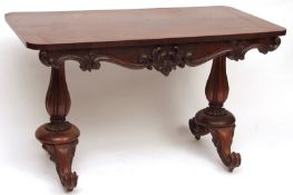 An early Victorian Rosewood Side or Library Table, of rectangular form, raised on two fluted