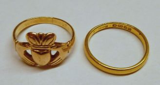 An Antique Gold “Claddagh” Ring (unmarked, repaired); and a 22ct Gold Wedding Ring, weighing in