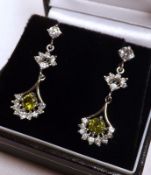 A pair of white metal Green Topaz and White Sapphire Drop Earrings, of chandelier design, 33mm drop,