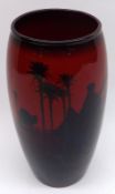 A Royal Doulton Flambé tapering wide necked Vase, decorated with a desert scene with Touaregs, camel