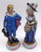 A pair of early 20th Century Continental Figures of a lady and gent decorated in colours and