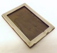 A George V Rectangular Photograph Frame with engine-turned edges, wooden back (lacking easel),