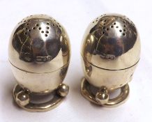 A pair of late Victorian small three footed Egg-shaped Peppers, London 1894, 2” high