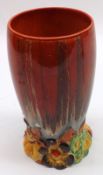 A Clarice Cliff “My Garden” Circular Vase of tapering form, with red and ochre streaked body and