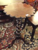 A 19th Century Mahogany Pedestal Table with roundel moulded circular top over a twisted support