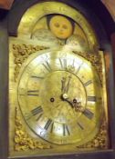 A 19th Century Mahogany Longcase Clock, with swan neck pediment over an arched brass dial with