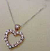 A white metal all white stone set Open Heart Pendant on trace chain, stamped “925”, 19mm drop