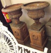 A pair of large Terracotta Garden Urns in the classical style, decorated with acanthus leaf detail