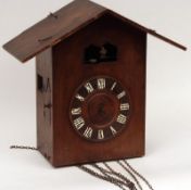 A late 19th Century Triple Weight Wall Mounted Cuckoo Clock, retailed by Camerer, Cuss & Co, the
