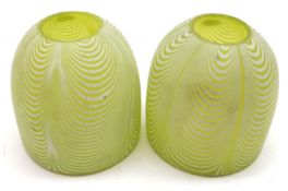 A pair of small Uranium Glass Night Light Covers, decorated with swirled white pattern, 3 ¼” high